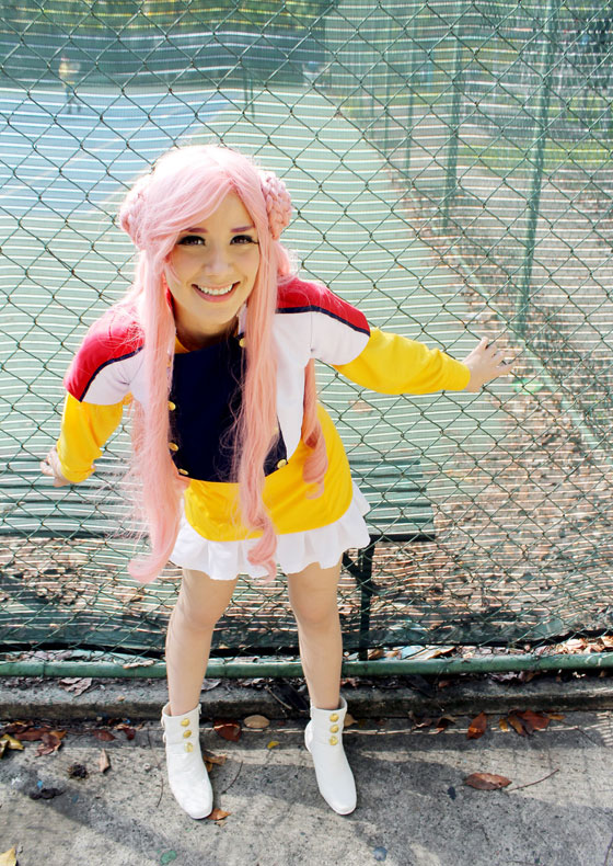 cosplay of Euphemia li Britannia holding onto a fence